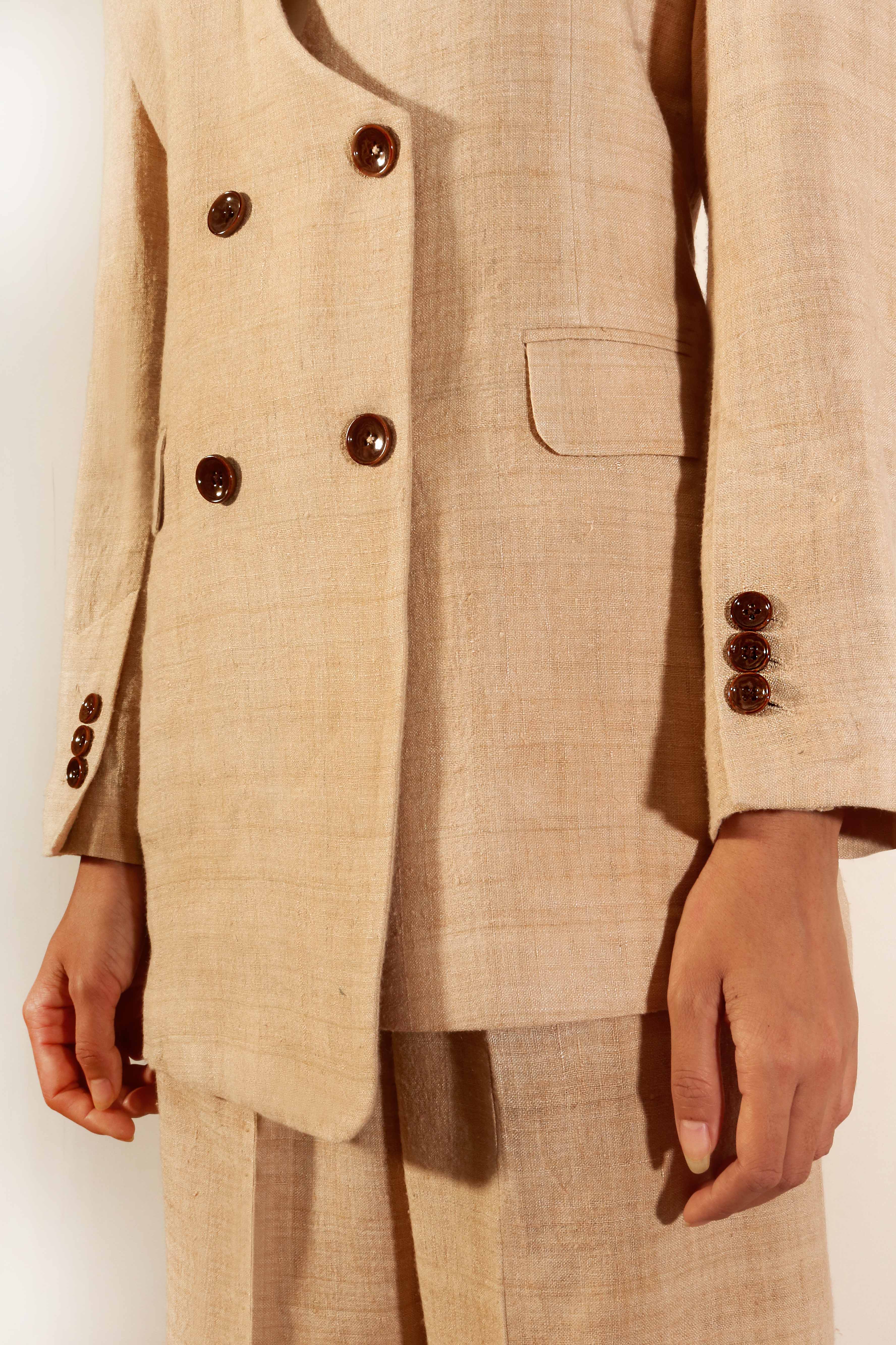 Double breasted 2X2 button collarless Tea dyed Eri Silk suit with  asymmetrical hem. – URA MAKU